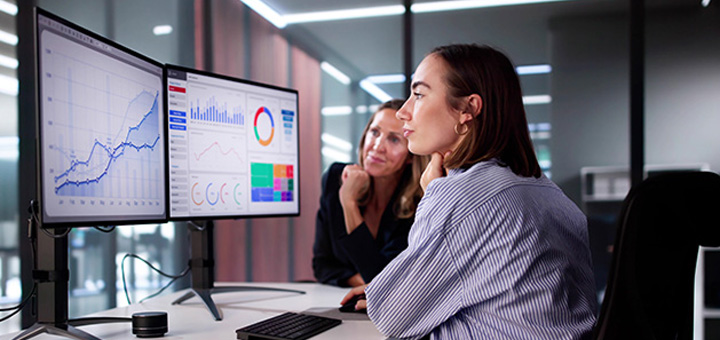 AV Managed Services - Two woman looking at computer screen