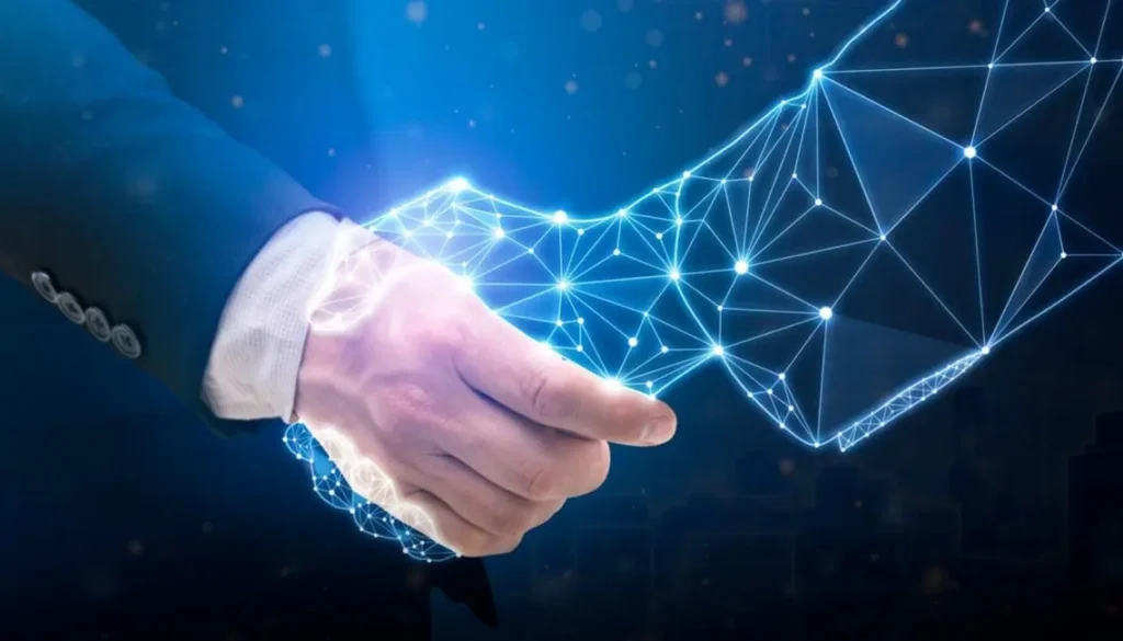 A businessperson’s hand reaches toward a glowing blue digital network of connected points and lines, evoking innovation, technology, and collaboration.