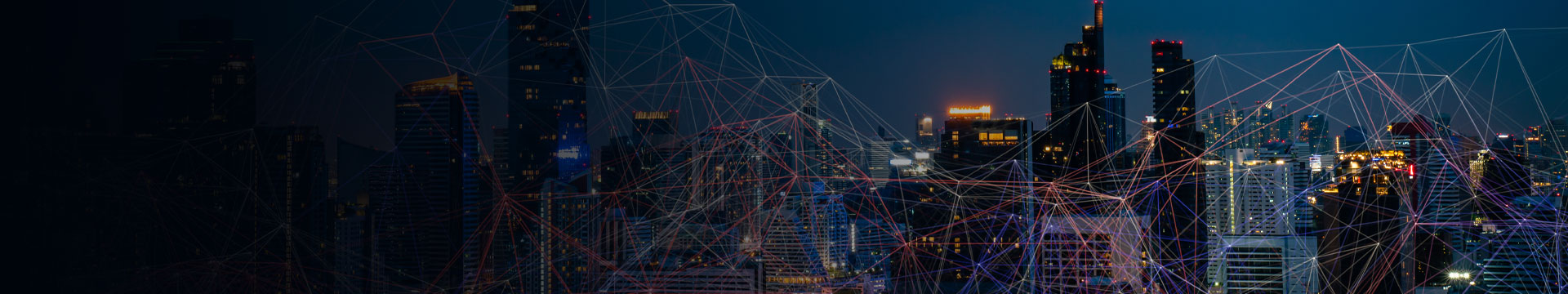 Nighttime urban skyline connected by digital network lines and nodes, representing business connectivity, cloud technology, and enterprise networking.